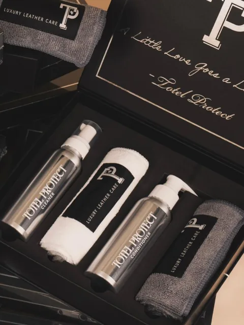 The Signature Leather Interior Kit open, with cleaner, conditioner and two microfibre cloths